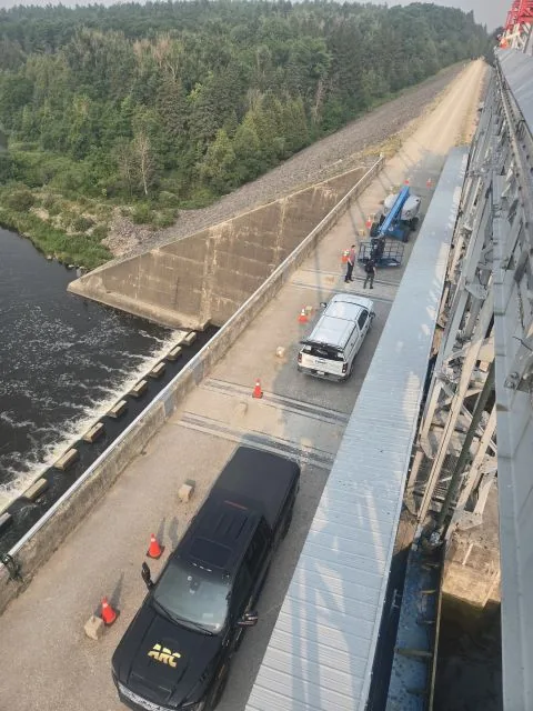 Looking down the spillway, with the ARC crew and lift on the deck