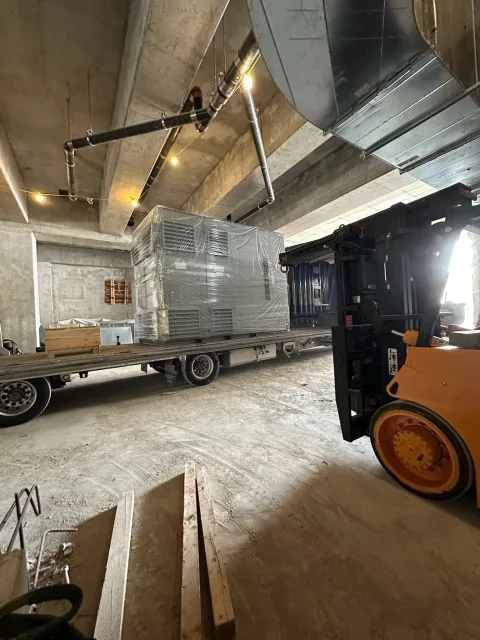Wrapped transformer on the flatbed in the basement level