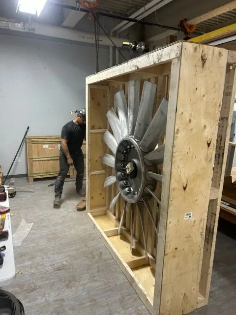Aluminium fan impeller as delivered, still in its shipping crate